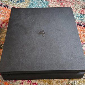 1 TB PlayStation 4 console with 1 controller and power cable.